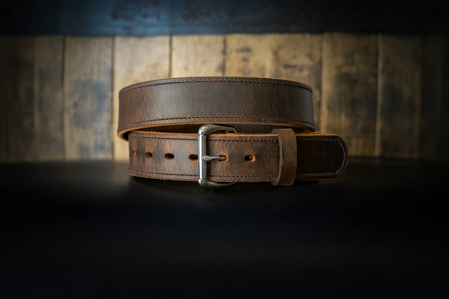 Leather manufacturing context: belt making at a workbench