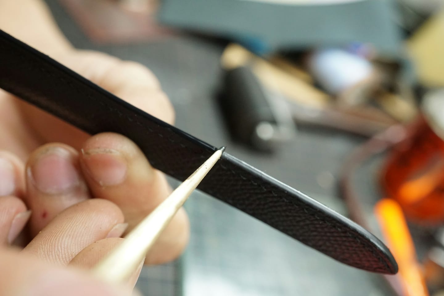 Material detail: a burnished leather edge