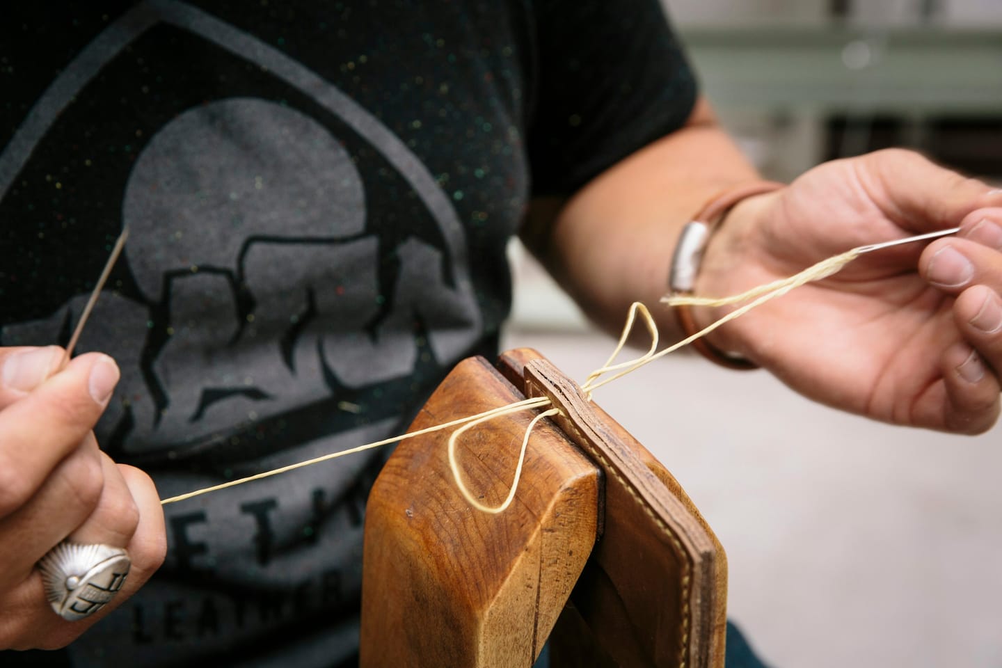 Material detail: a branding stamp pressed into leather