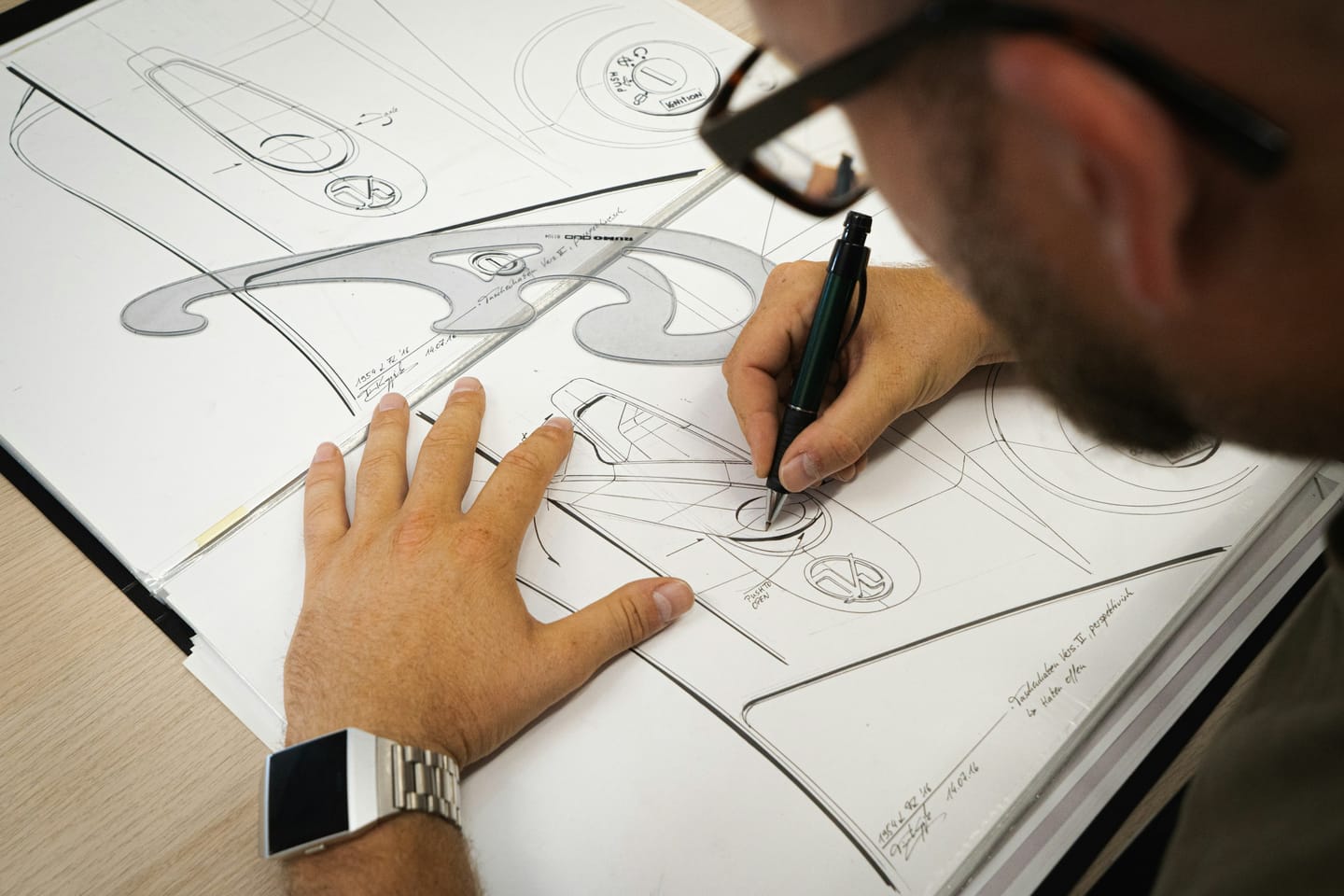 Accessories manufacturing context: product development materials on a table