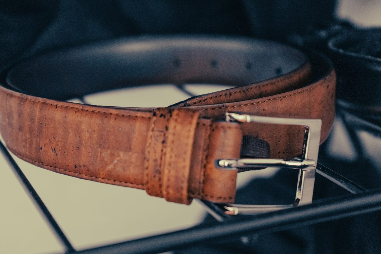Leather manufacturing context: belt assembly at a bench