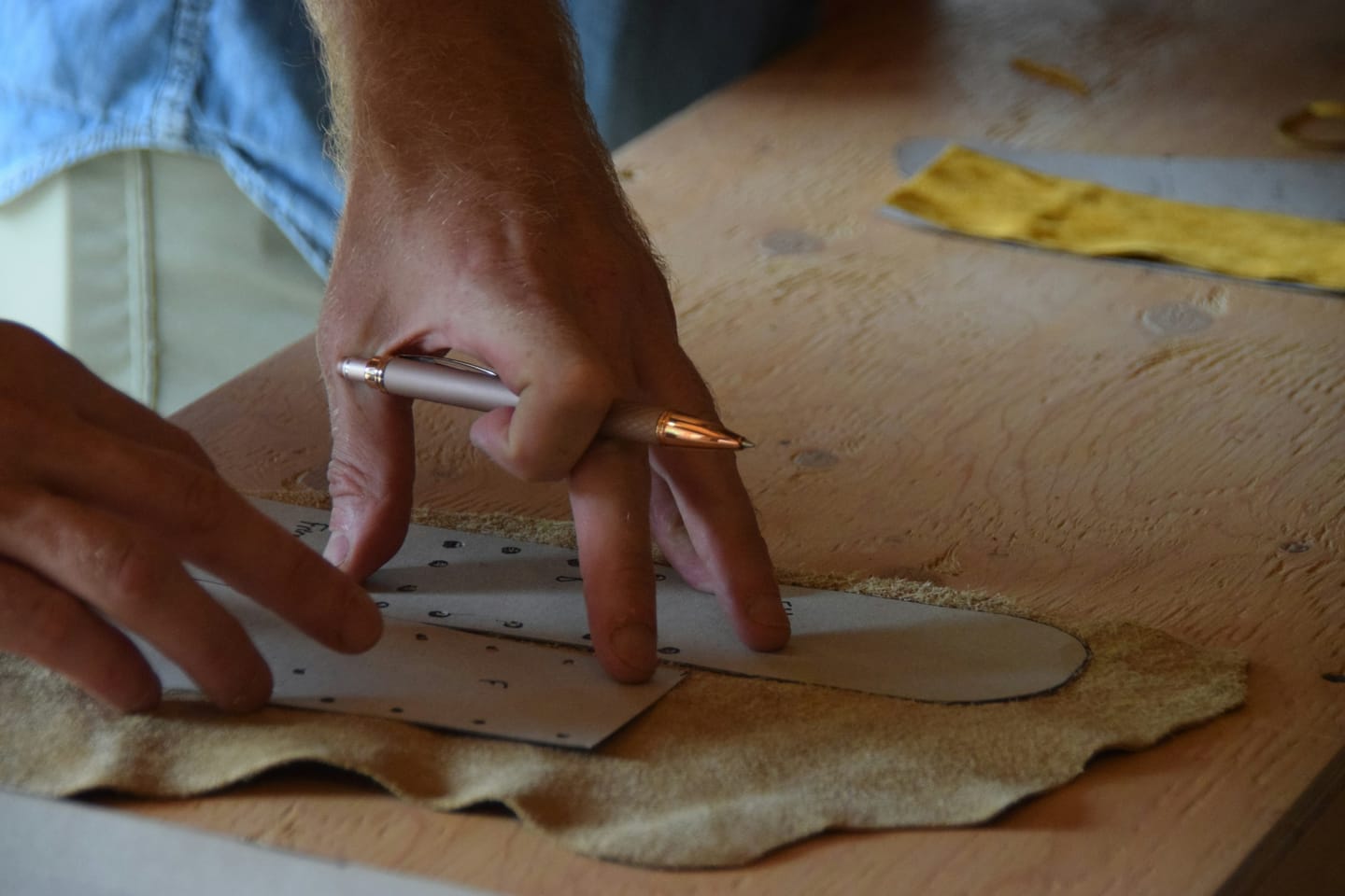Leather manufacturing context: leather being worked by hand